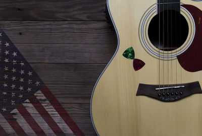 High angle view of guitar on table