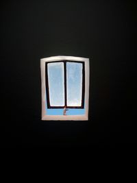 Close-up of window against blue sky