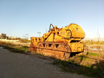 Abandoned train on railroad track against sky