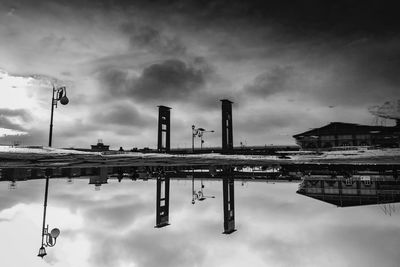 Reflection of factory on cloudy sky