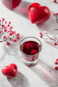 Red cocktail, vodka or liqueur and heart shape decorations