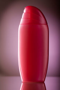 Close-up of pink glass against white background