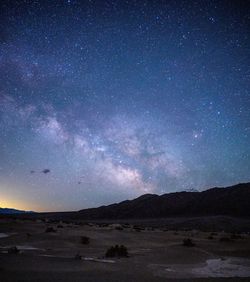 Scenic view of mountain against sky at night