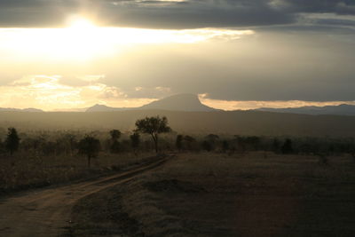 Scenic view of field against sky during sunset