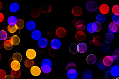 Defocused image of illuminated lights at night