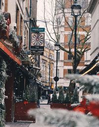 Street and buildings in city during winter