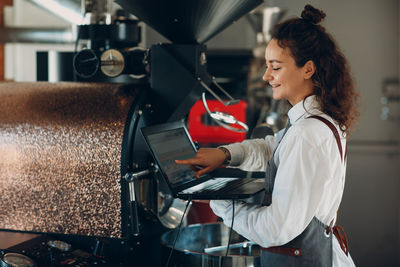 Side view of a woman working