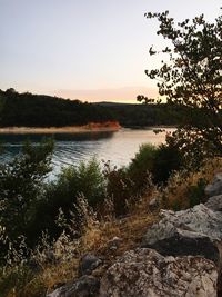 Scenic view of river against clear sky