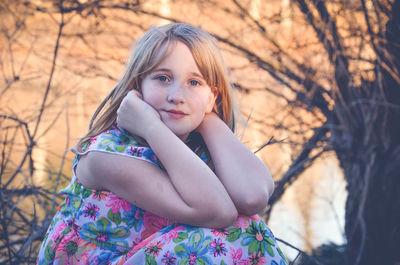 Close-up portrait of girl in forest