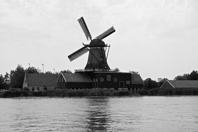 Traditional windmill against sky