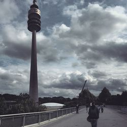 Silhouette of building against cloudy sky