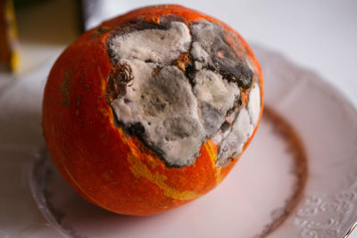 Close-up of orange slice in plate on table