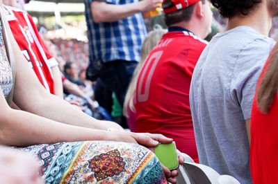 Midsection of couple holding hands