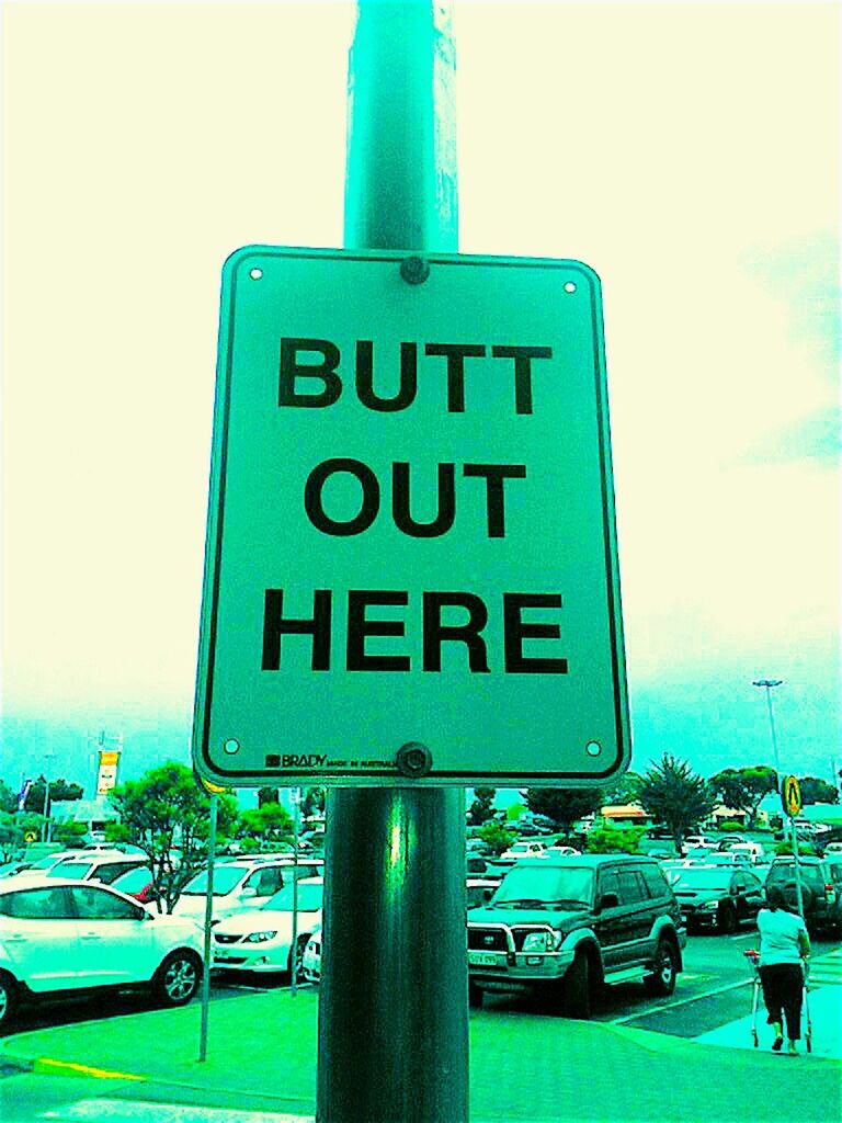 ROAD SIGN AGAINST BLUE SKY