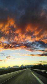 Road against dramatic sky during sunset