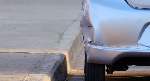 Close-up of car on street