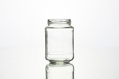 Close-up of glass of water against white background