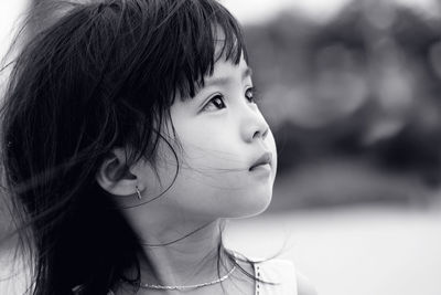 Close-up portrait of a girl looking away