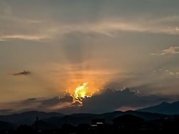 Scenic view of silhouette mountains against sky during sunset