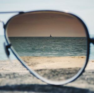 Close-up of sea seen through glass