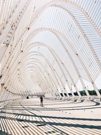 Low angle view of people walking on ceiling