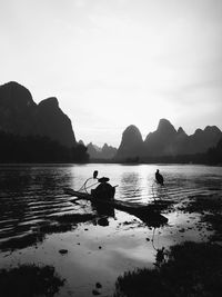 Scenic view of lake with mountains in background