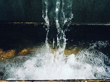 Close-up of water splashing against sky