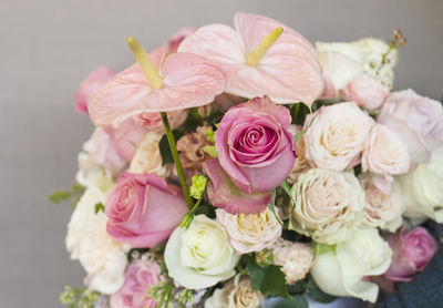 The delicate rustic floral bouquet of rose lilac peony on grey background