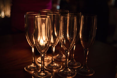 Close-up of wine glasses on table