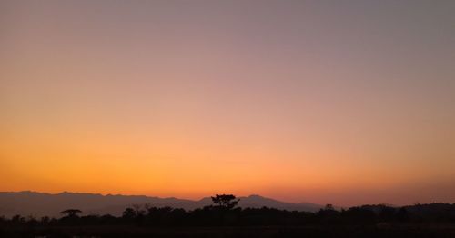 Scenic view of silhouette landscape against sky during sunset