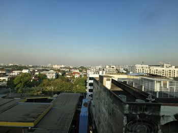 High angle view of buildings against clear blue sky