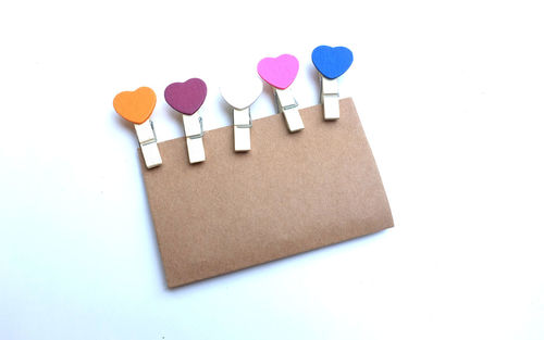 Colorful wood paper clip heart set isolate on white background.