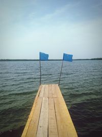 Pier over sea against sky
