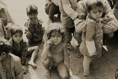 Children sitting in traditional clothing