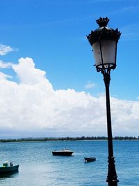 Scenic view of sea against blue sky