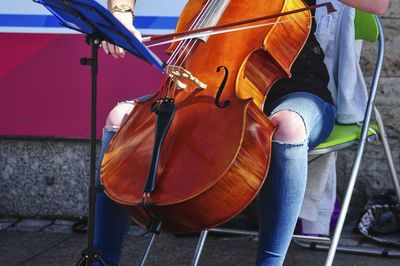 Low section of a woman playing violin
