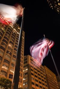 Low angle view of illuminated building at night