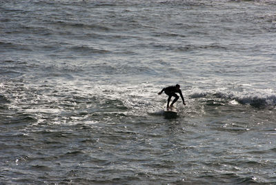 Full length of man standing in sea