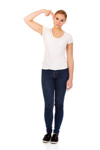 Portrait of a smiling young woman against white background