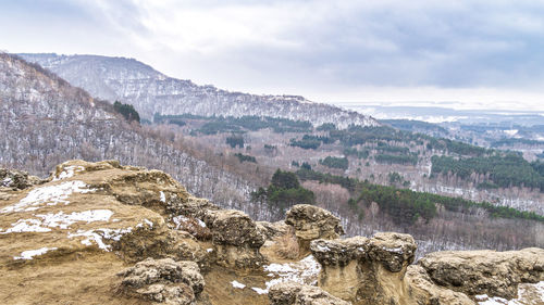 Scenic view of landscape and mountains against sky