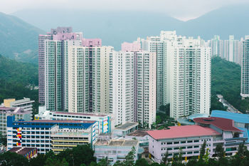 High angle view of buildings in city against sky