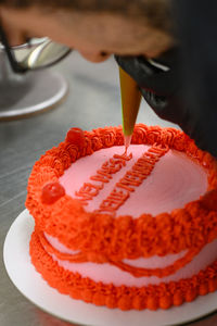 Cropped hand of woman holding heart shape