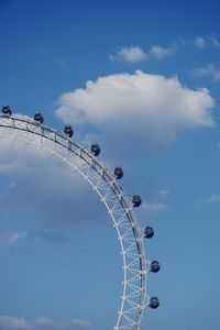 Low angle view of ferris wheel against sky