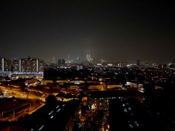 Illuminated cityscape at night