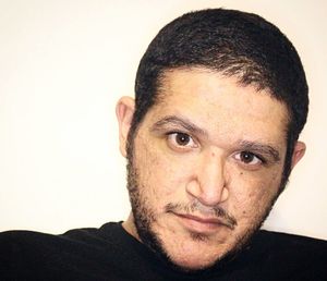 Portrait of young man against white background