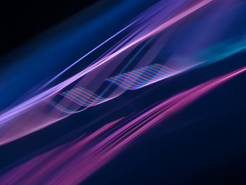 Close-up of light trails over black background