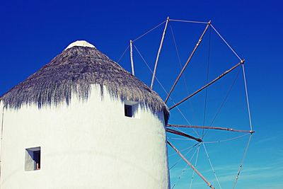 Low angle view of roof against blue sky