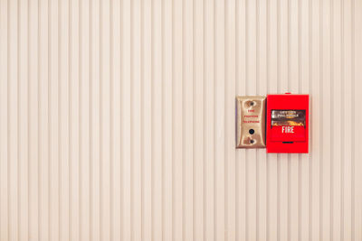 Close-up of fire alarm on wall