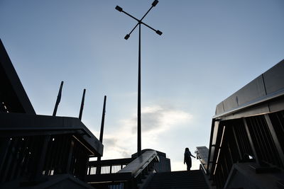 Low angle view of street and buildings against sky