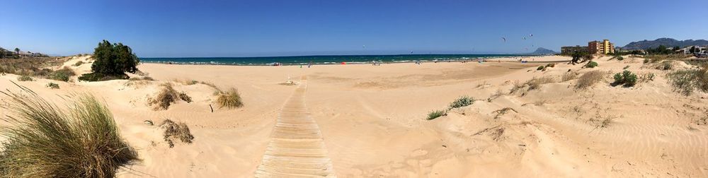 Panoramic view of beach against clear sky